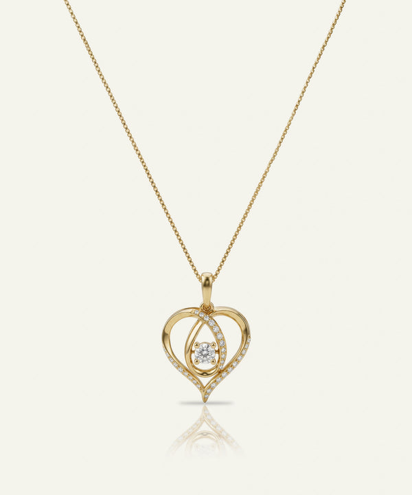Gold heart-shaped pendant necklace with a diamond on a white background