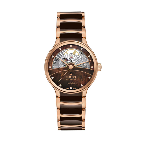 Rose gold and brown watch with Rado branding on a white background
