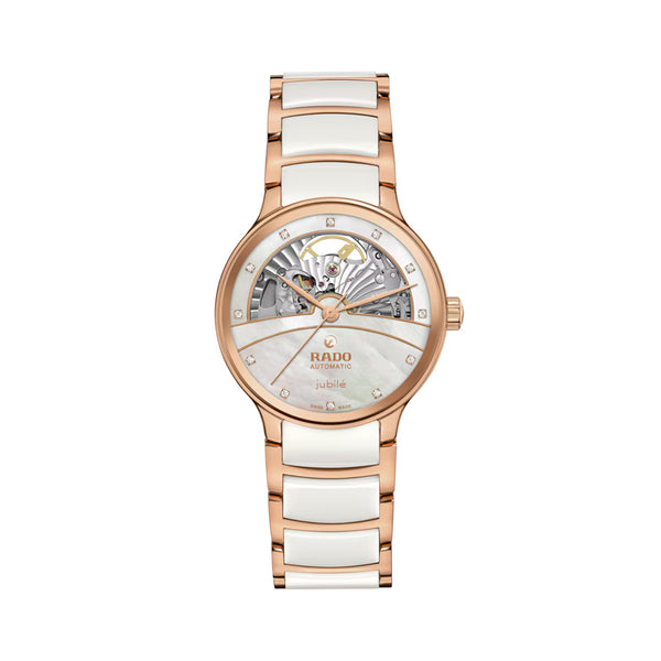 Rose gold and white ceramic watch with Rado brand on a white background