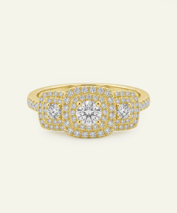 Gold ring with diamonds on a white background