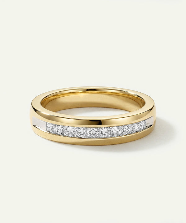 Gold ring with embedded diamonds on a white background