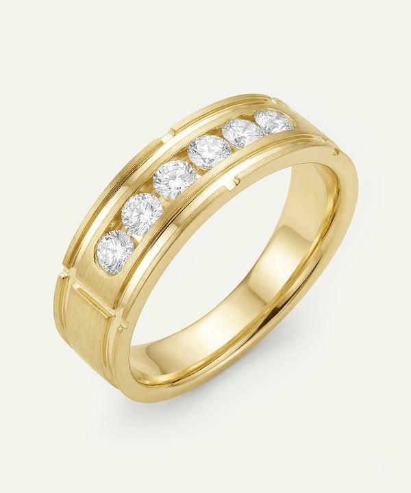 Gold ring with diamonds on a white background