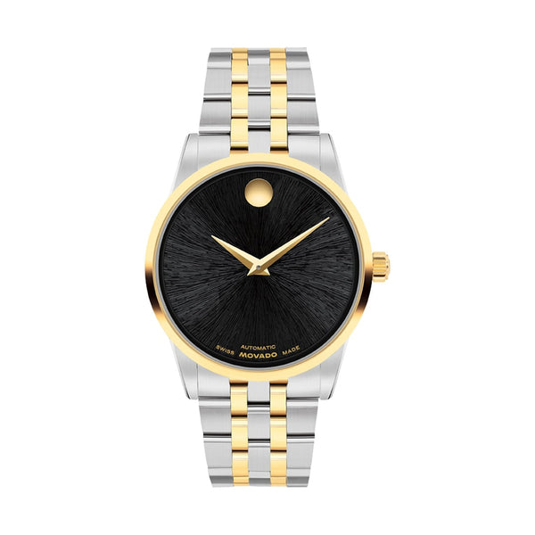 Watch with two-tone metal strap on a white background
