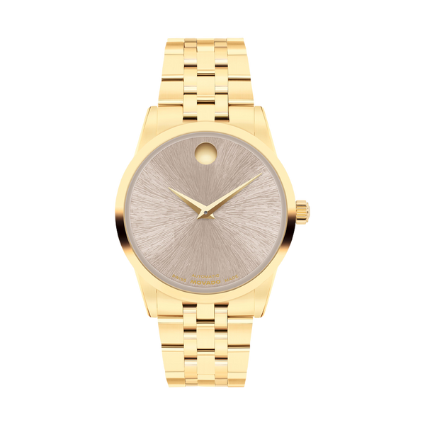 Gold wristwatch with a detailed face on a white background