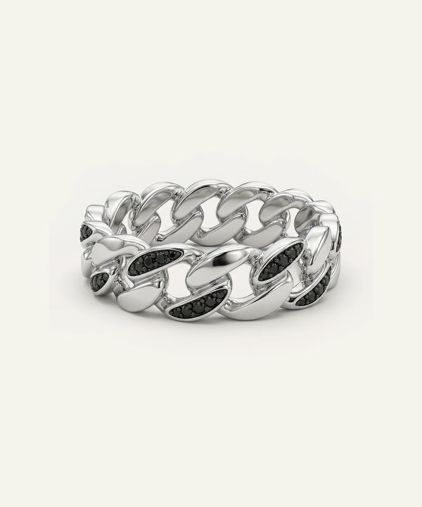 Silver chain ring with black stones on a white background