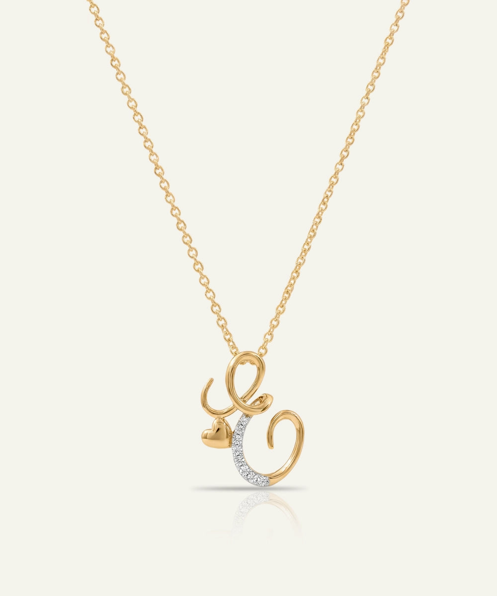 Gold necklace with a unique pendant on a light beige background