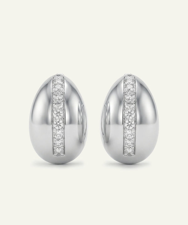 Pair of silver earrings with diamond accents on a white background
