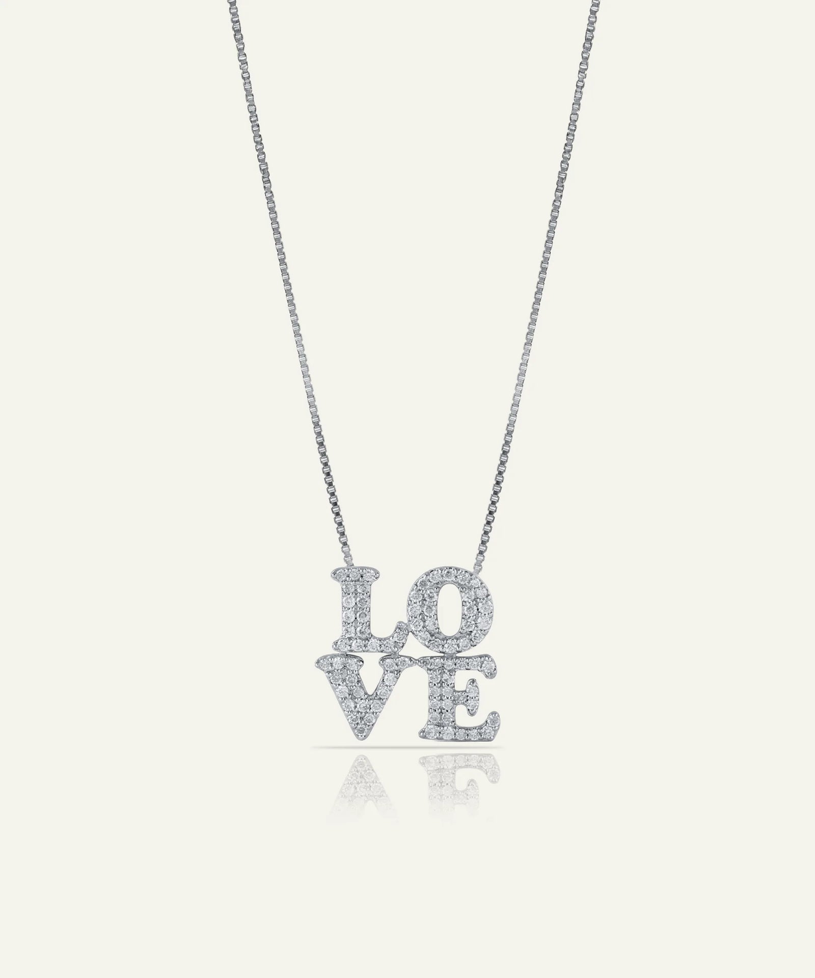 Silver 'LOVE' necklace on a white background