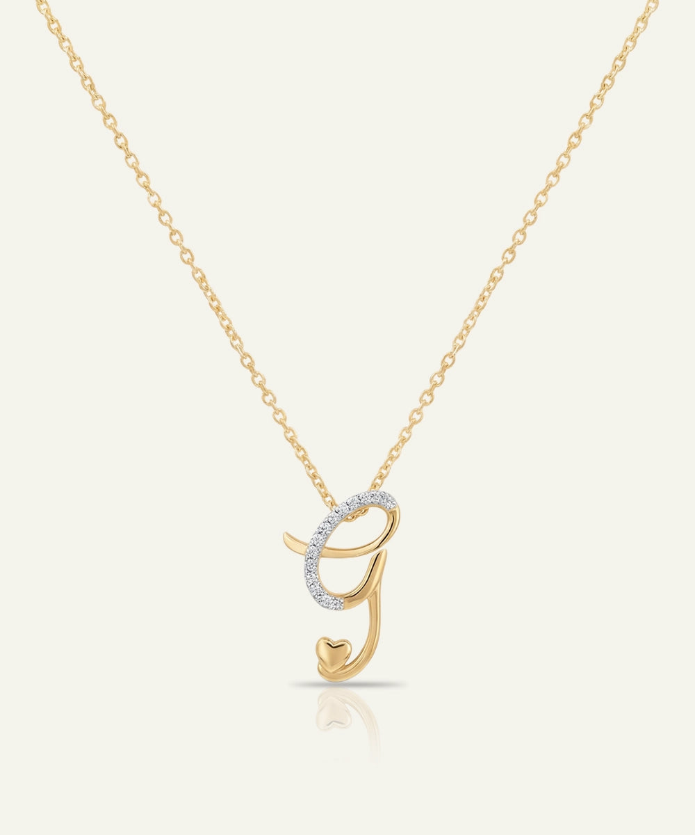 Gold necklace with a unique pendant on a white background