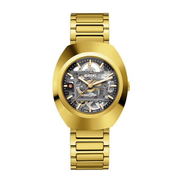 Gold wristwatch with a visible brand logo on a white background