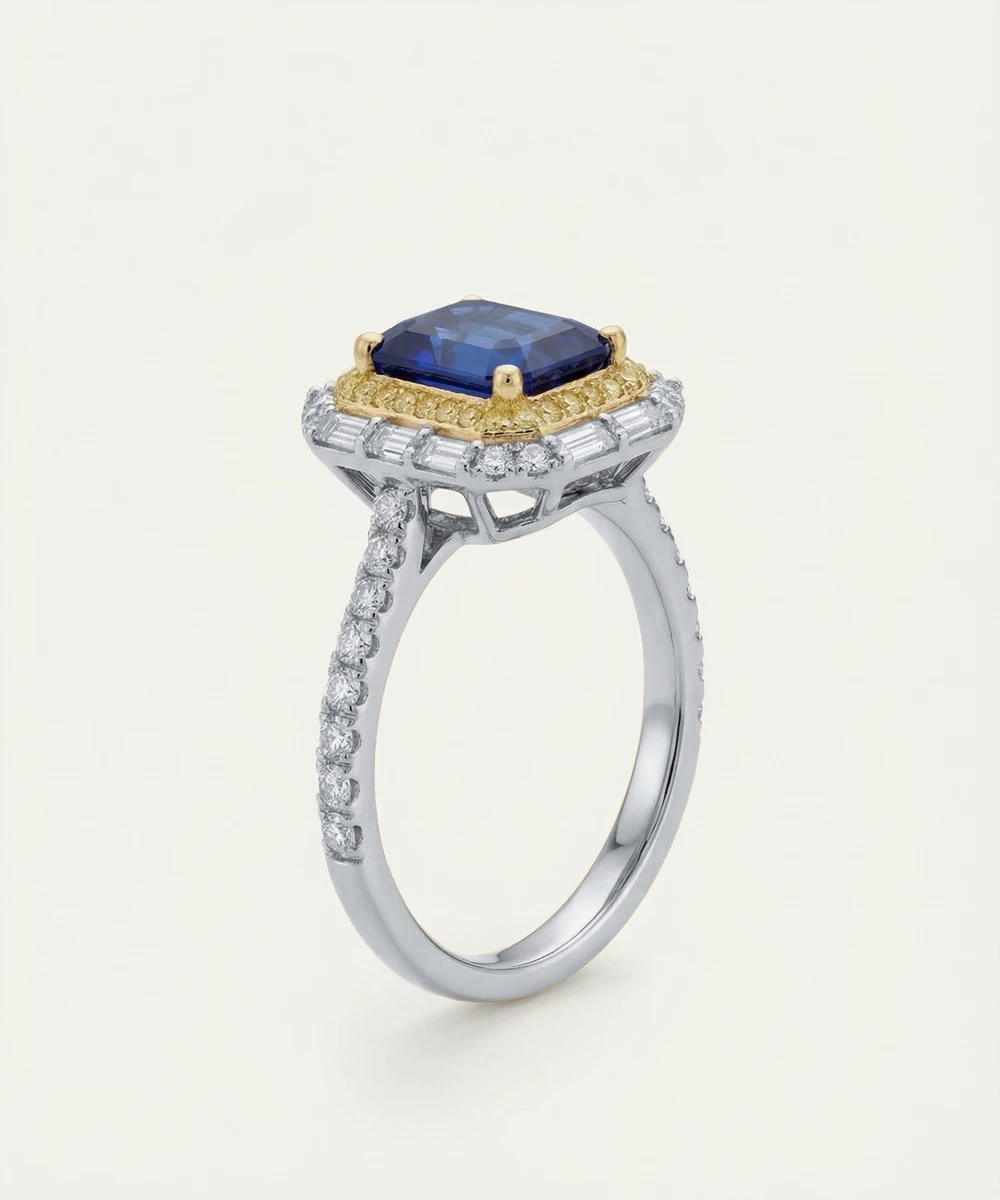 Elegant ring with a blue gemstone and diamond accents on a white background
