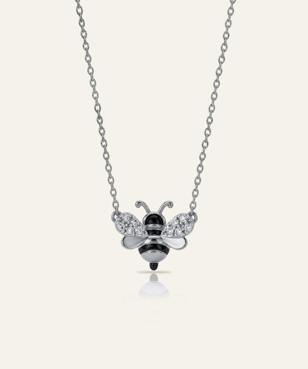 Bee-shaped pendant necklace on a white background