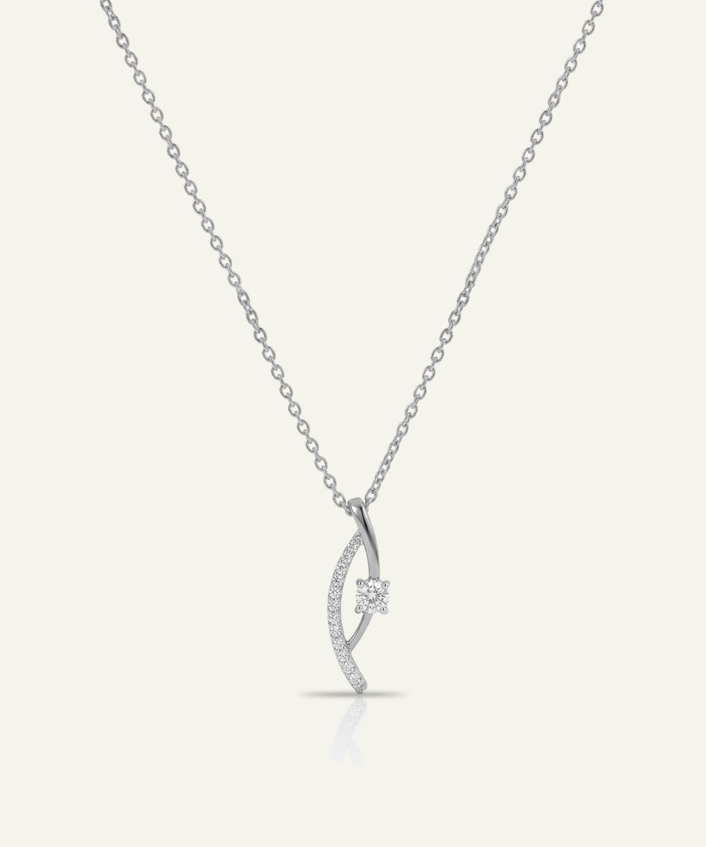 Silver necklace with a delicate pendant on a white background