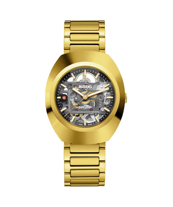Gold wristwatch with a detailed face on a white background