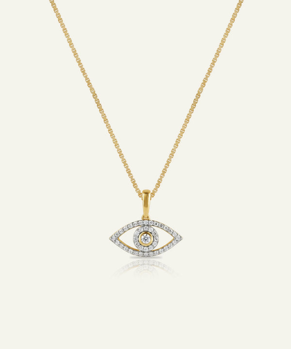 Gold necklace with an eye-shaped pendant on a white background