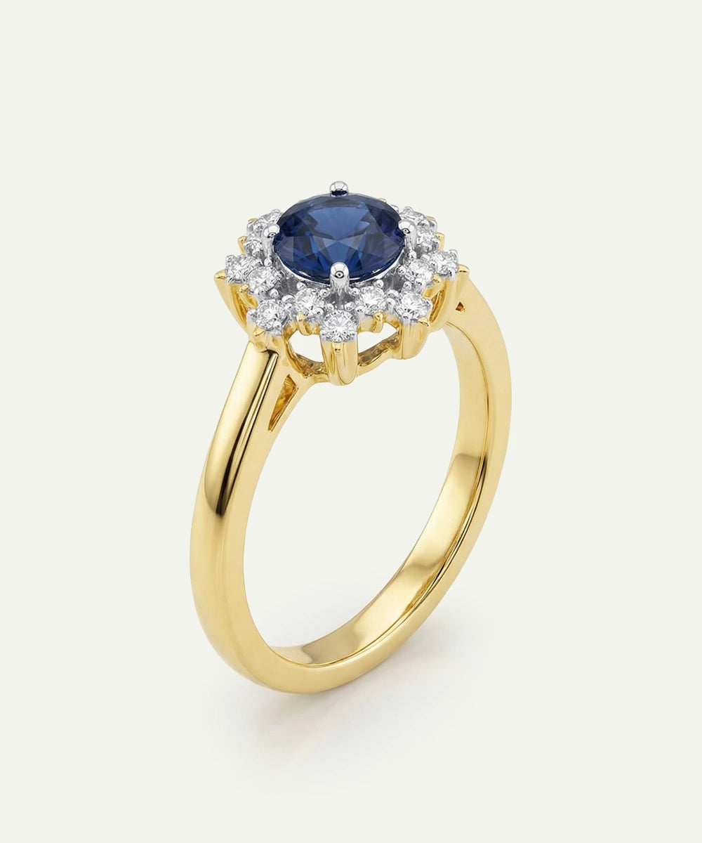 Gold ring with a blue gemstone and diamond accents on a white background