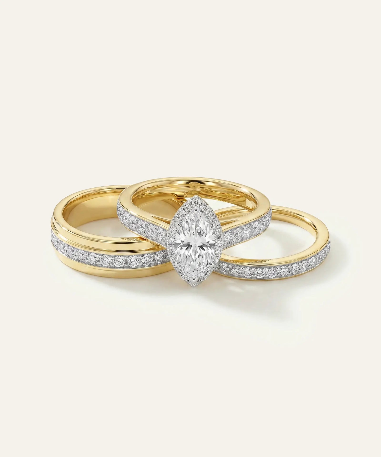 Gold ring with a diamond on a light gray background