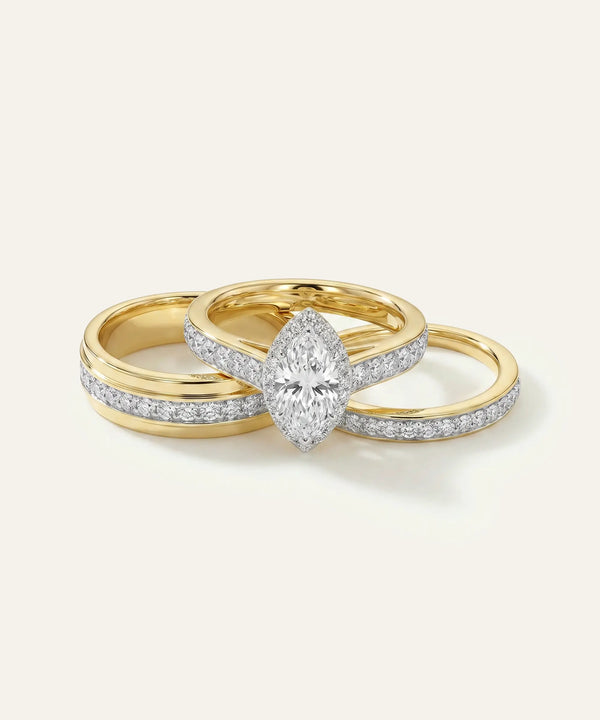 Gold ring with a diamond on a light gray background