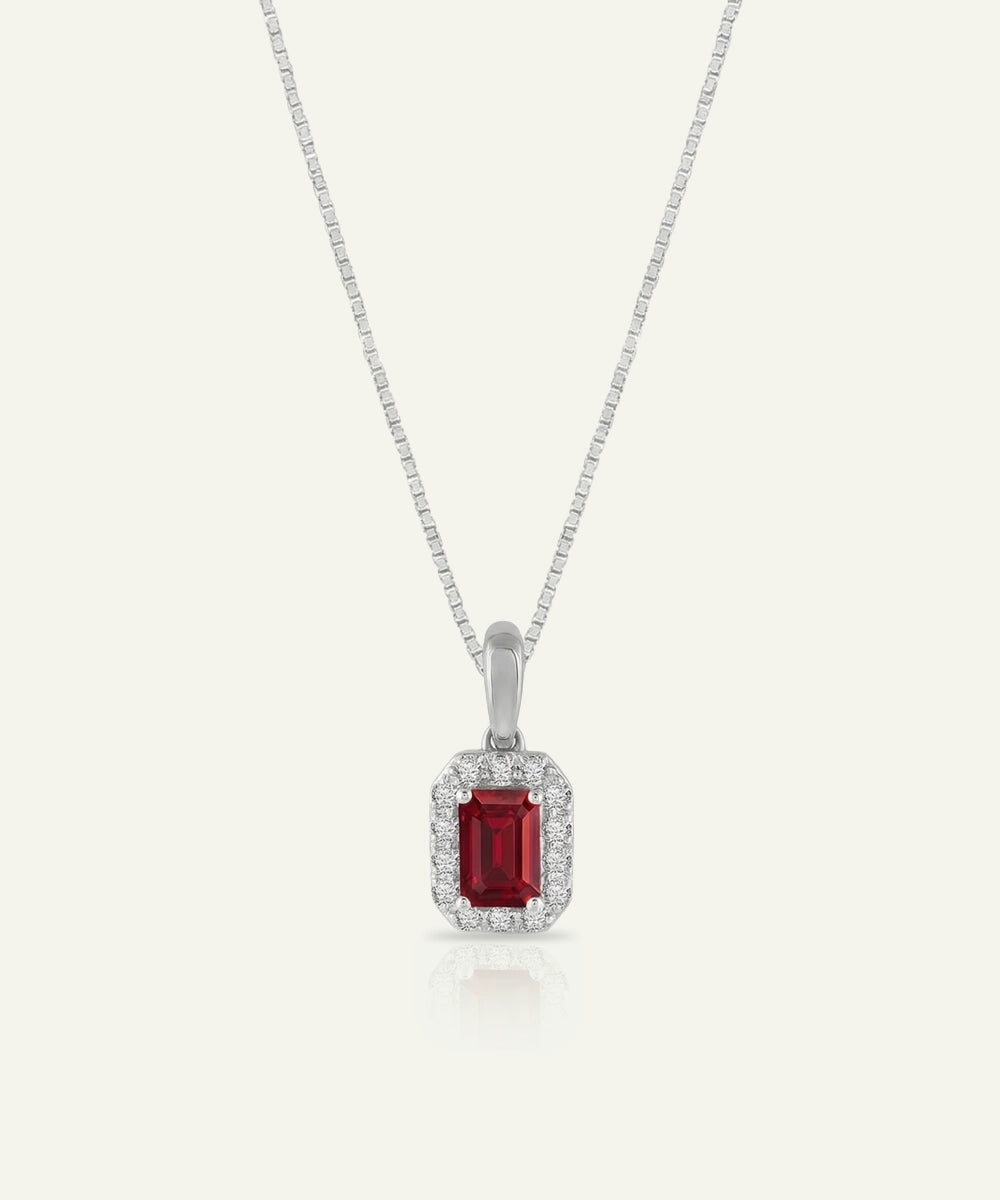 Ruby pendant necklace on a white background