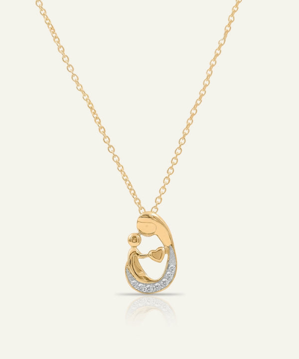 Gold necklace with a heart-shaped pendant on a white background