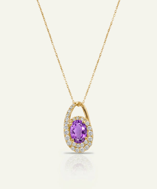 Gold necklace with a purple gemstone pendant on a white background