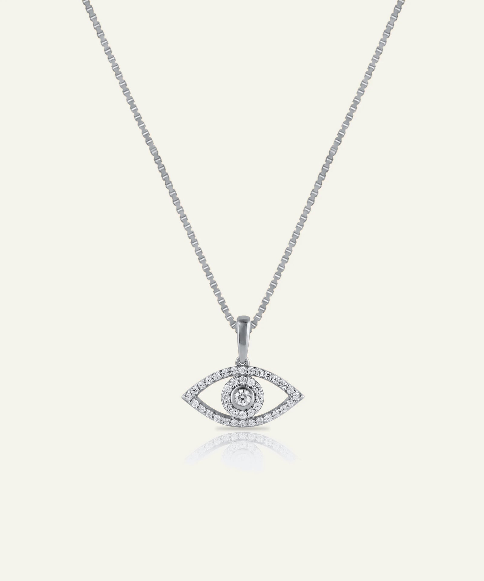 Silver necklace with an eye-shaped pendant on a white background