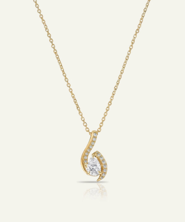 Gold necklace with a delicate pendant on a white background