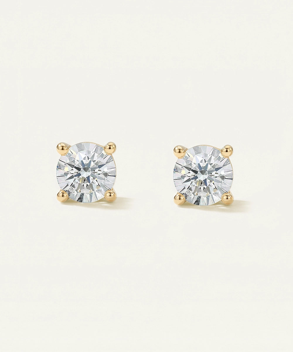 Pair of diamond stud earrings on a light gray background