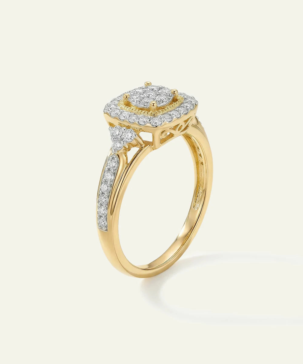 Gold ring with diamond accents on a light gray background
