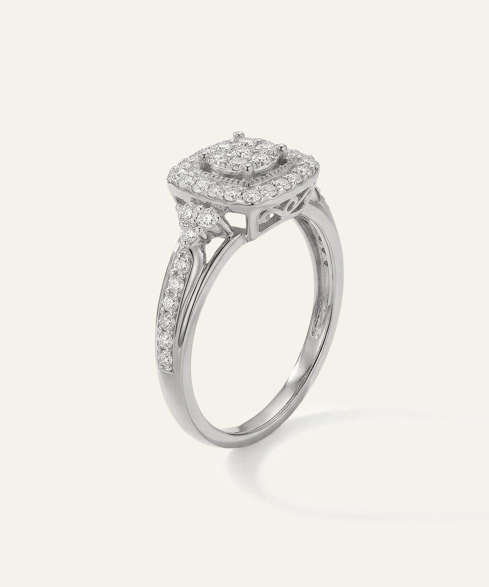 Silver ring with diamond accents on a white background