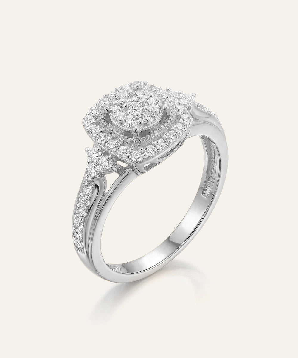 Silver ring with diamond accents on a white background