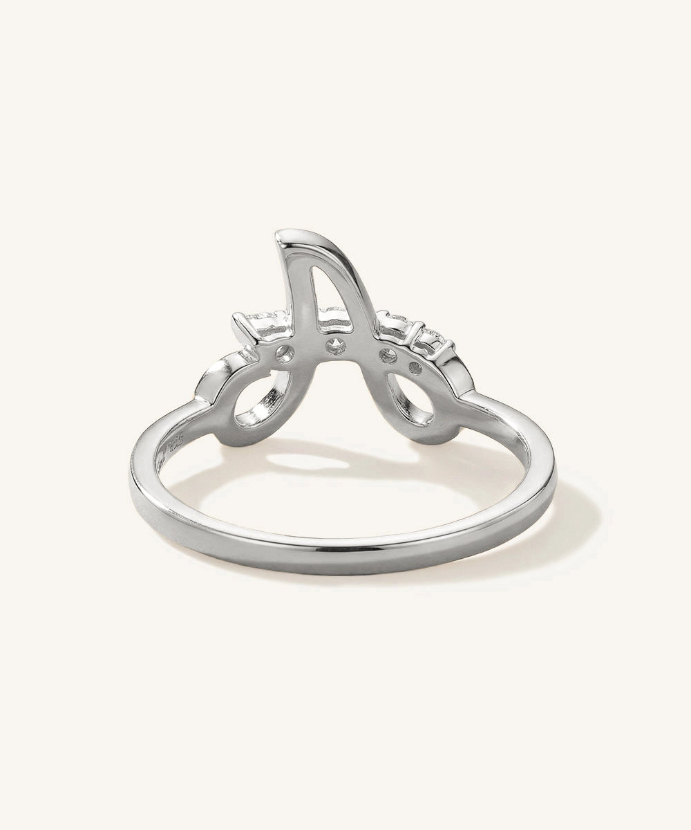 Silver ring with letter 'A' design on a white background