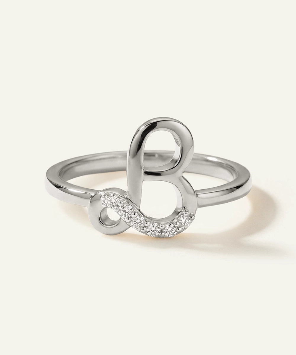 Silver ring with a unique design on a white background