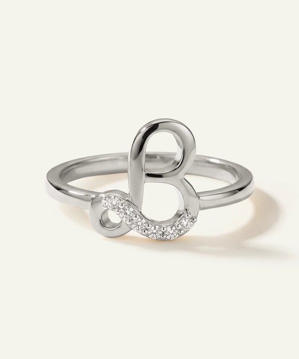 Silver ring with a unique design on a white background