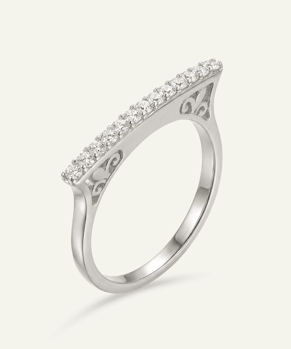 Silver ring with diamond accents on a white background