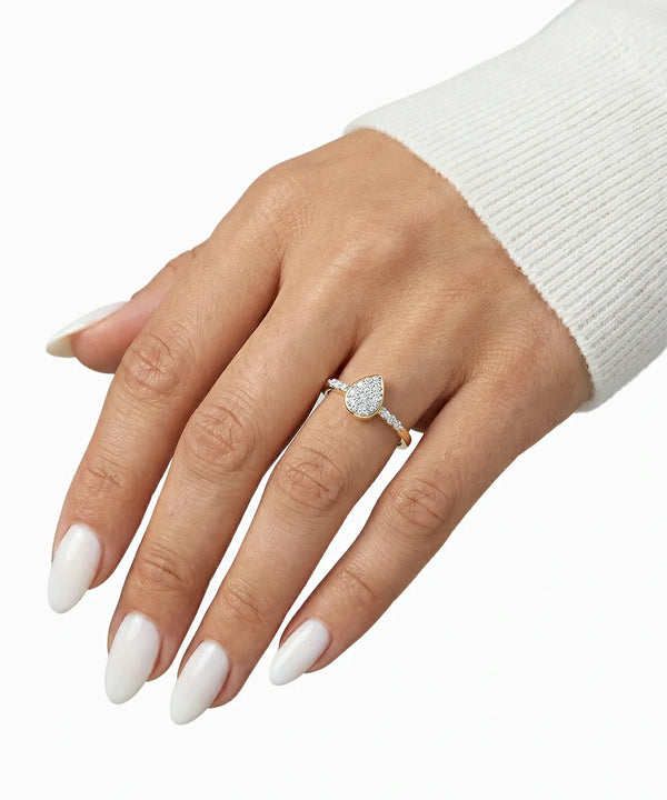 Hand wearing a diamond ring on a white background