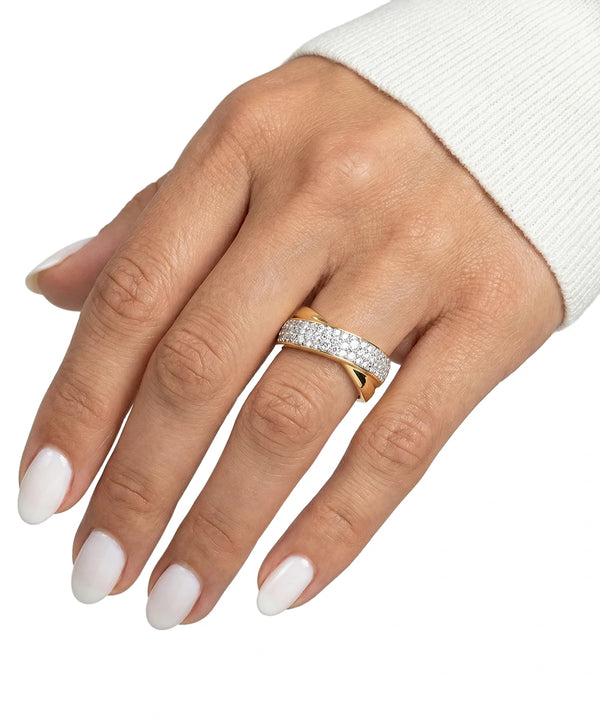 Hand wearing a gold and diamond ring on a white background