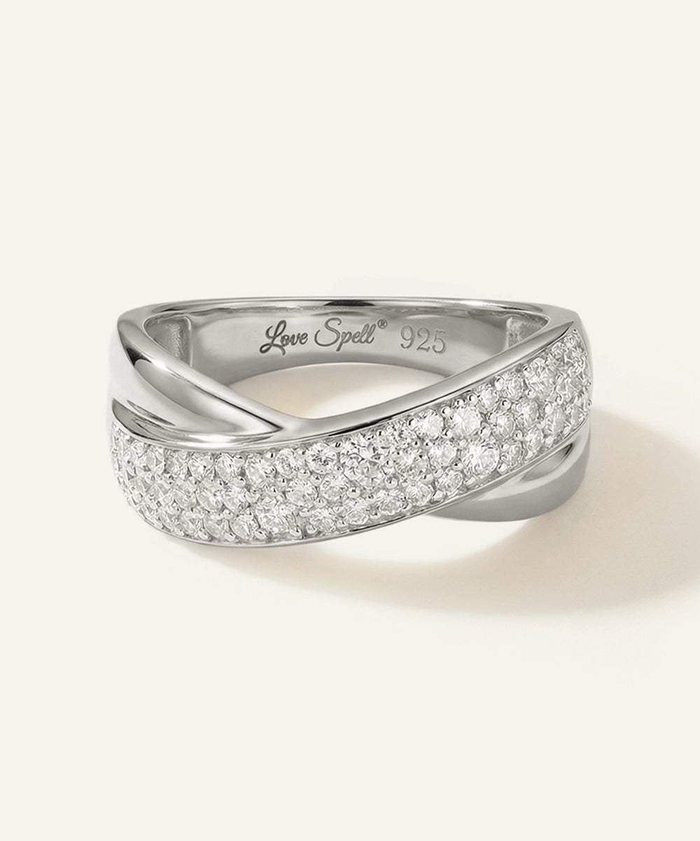 Silver ring with diamond accents on a white background