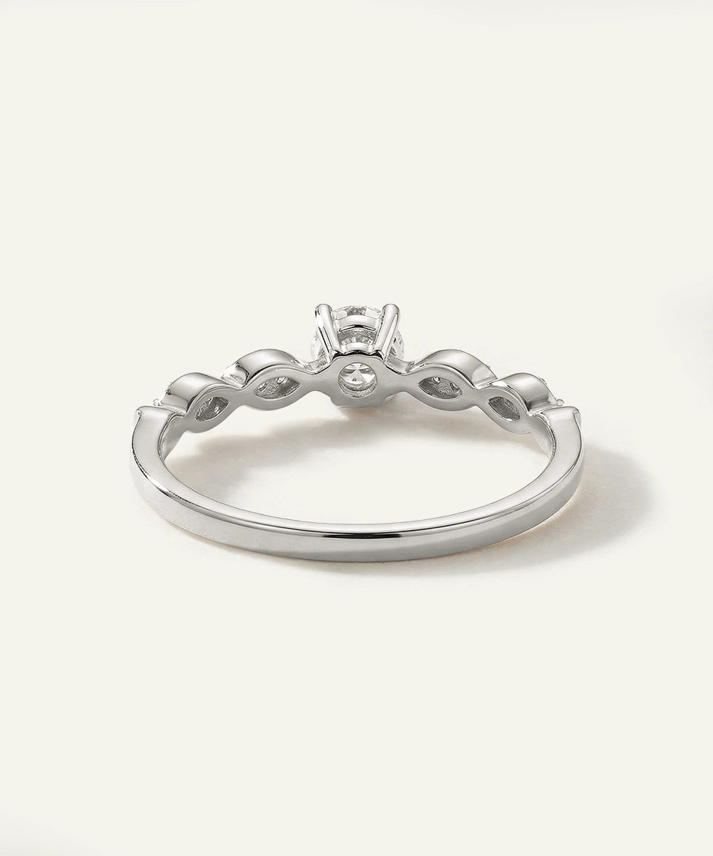 Silver ring with a diamond on a white background