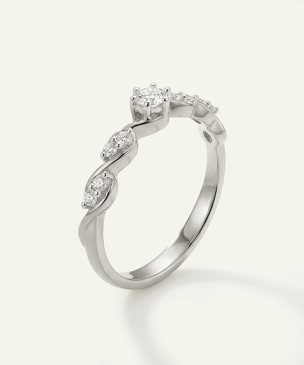 Silver ring with diamond accents on a white background