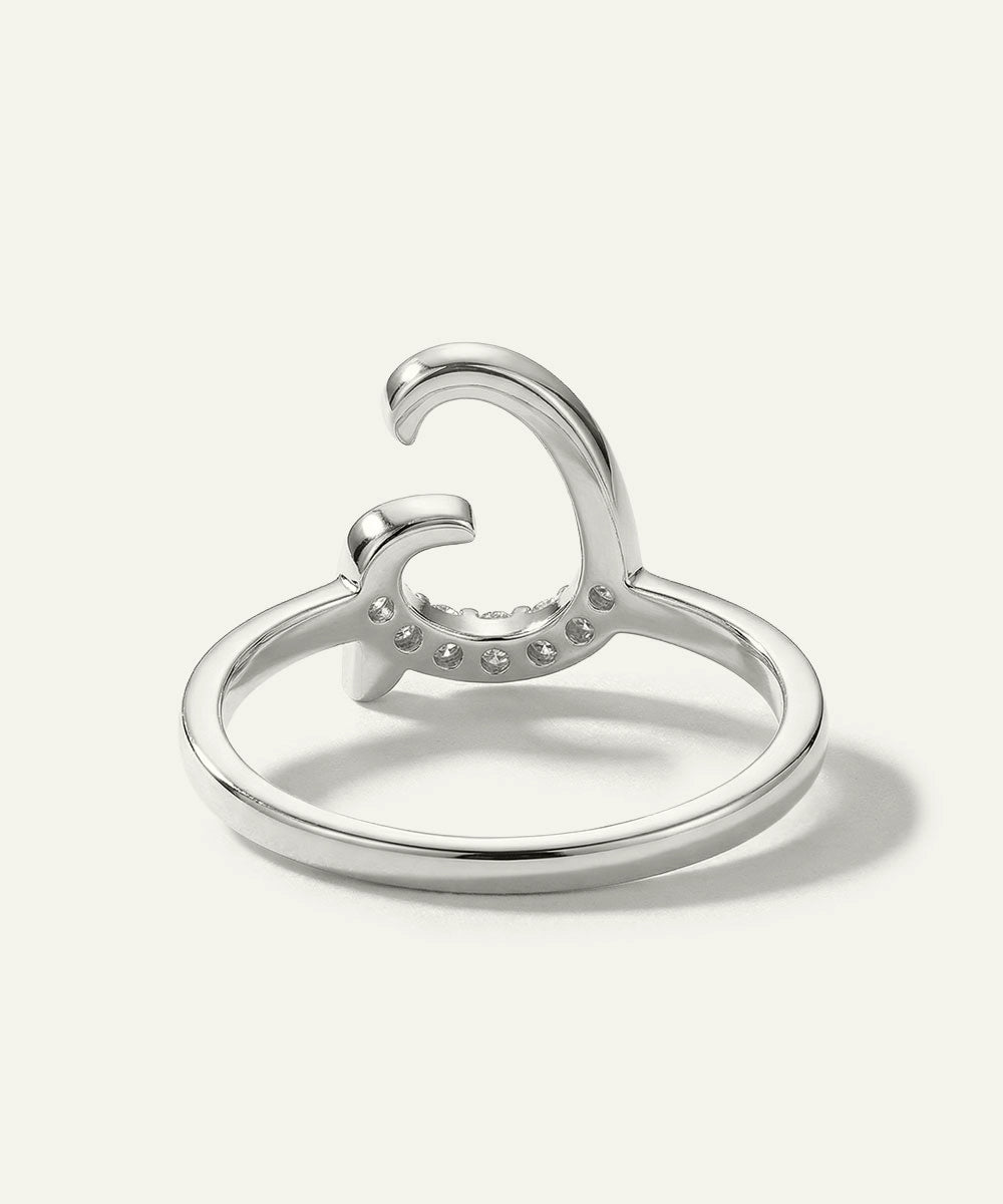 Silver ring with a unique design on a white background