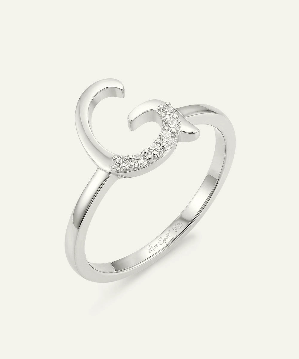 Silver ring with a decorative design on a white background