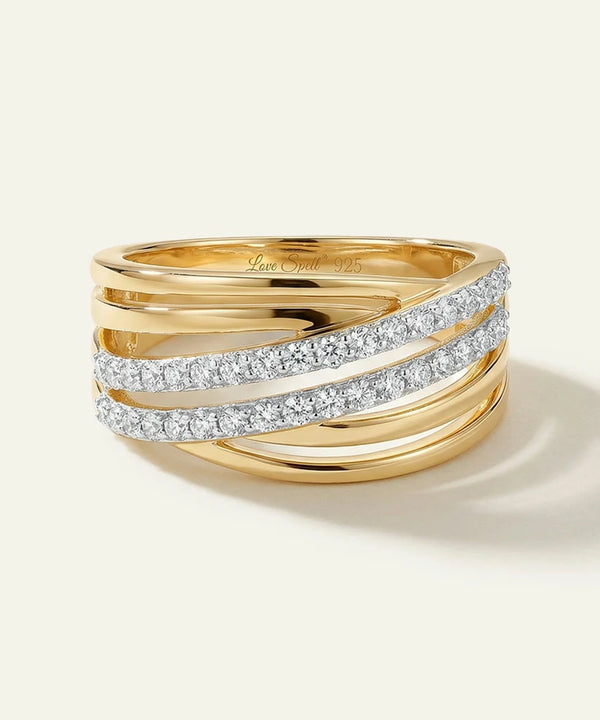 Gold ring with diamond accents on a white background