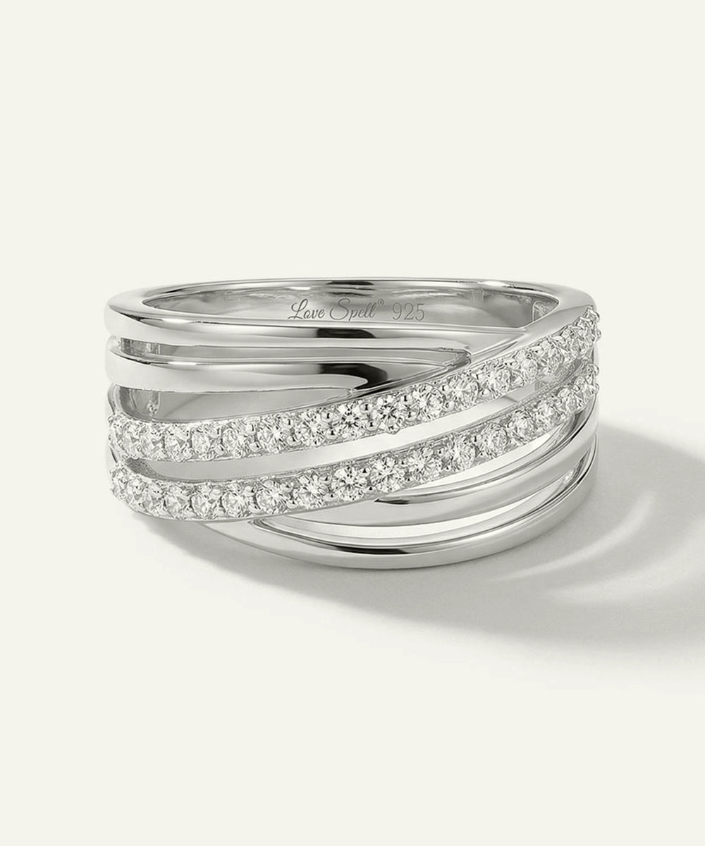 Silver ring with diamond accents on a white background