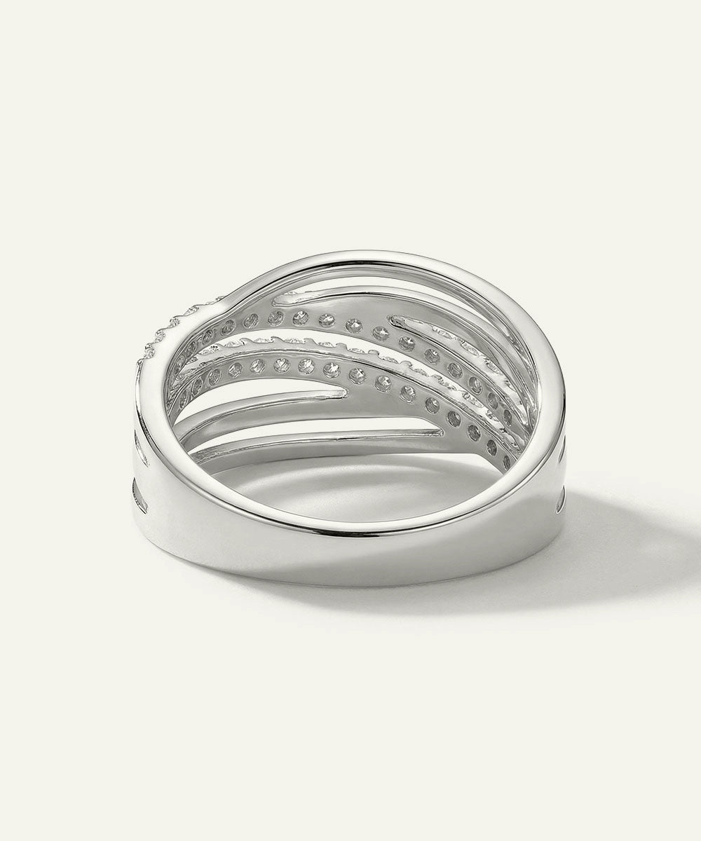 Silver ring with embedded stones on a white background
