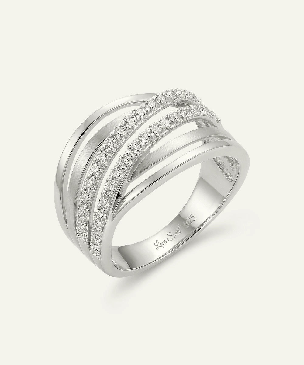 Silver ring with diamond accents on a white background