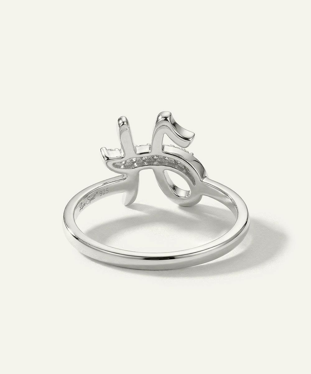 Silver ring with a unique design on a white background