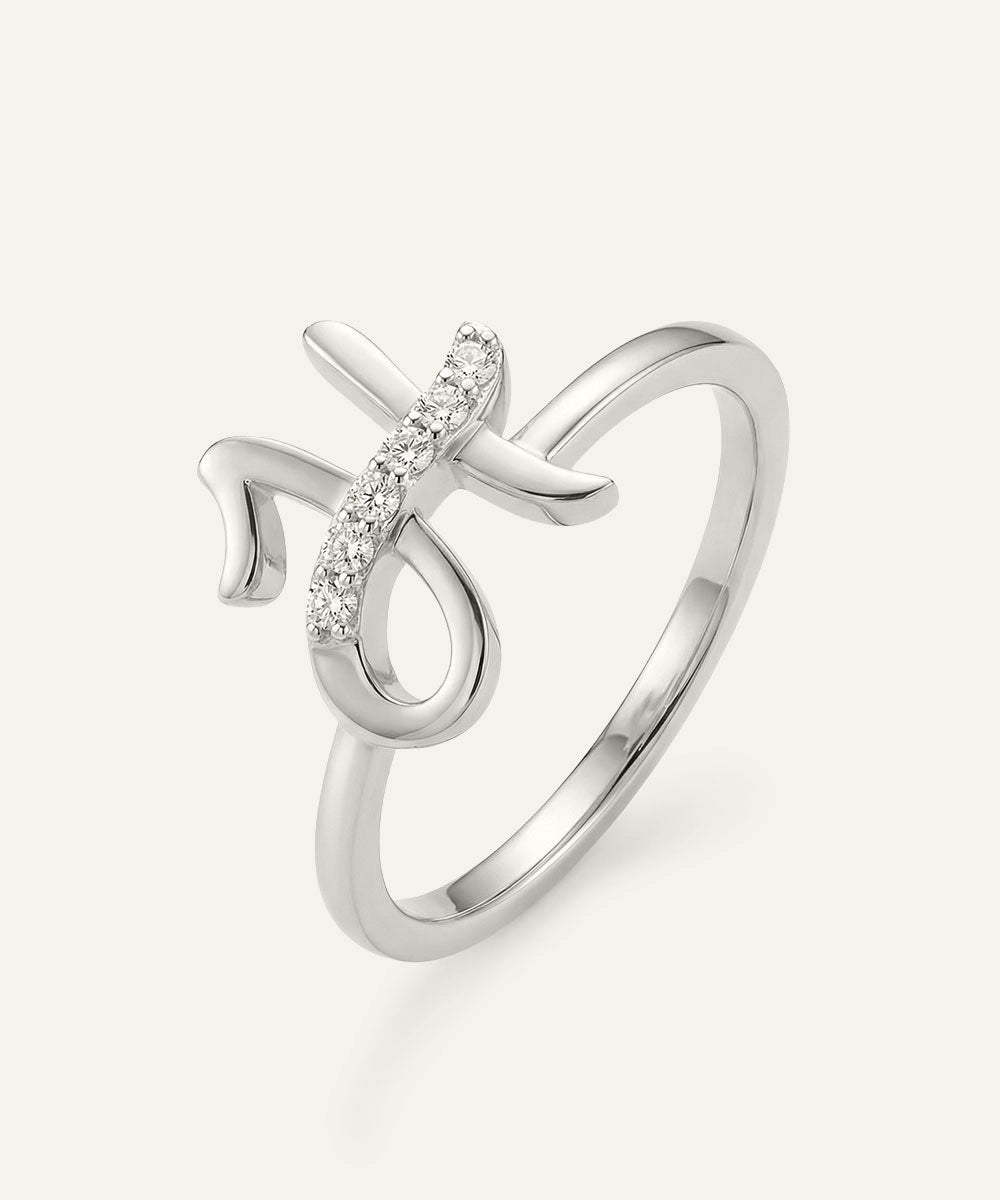 Silver ring with a decorative design on a white background