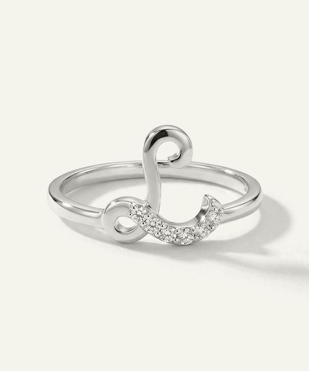 Silver ring with a unique design on a white background