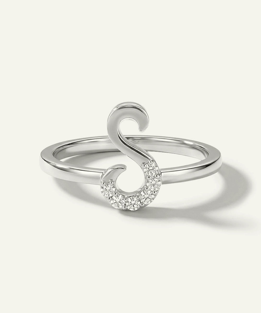 Silver ring with a unique design on a white background
